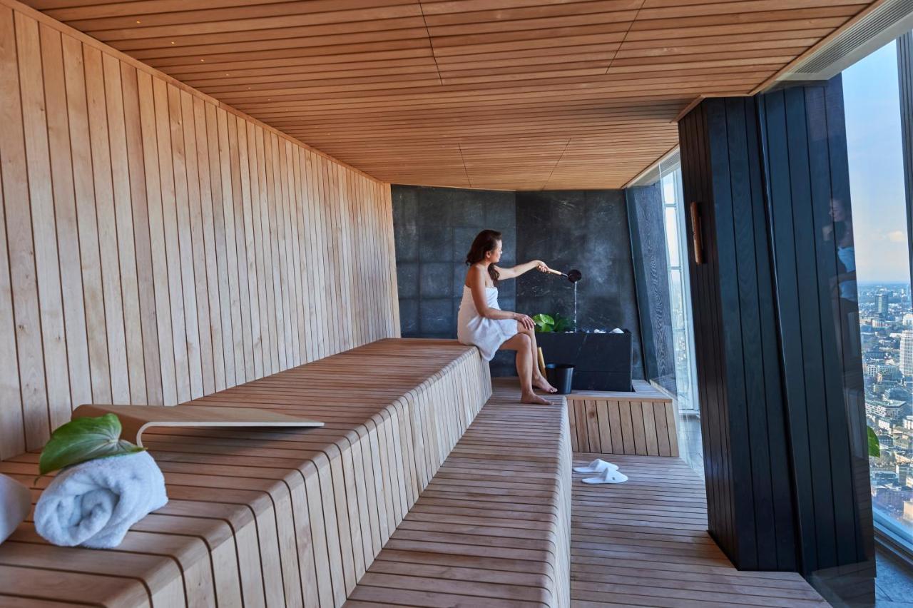 Shangri-La The Shard, London Exterior photo A woman in a Finnish sauna