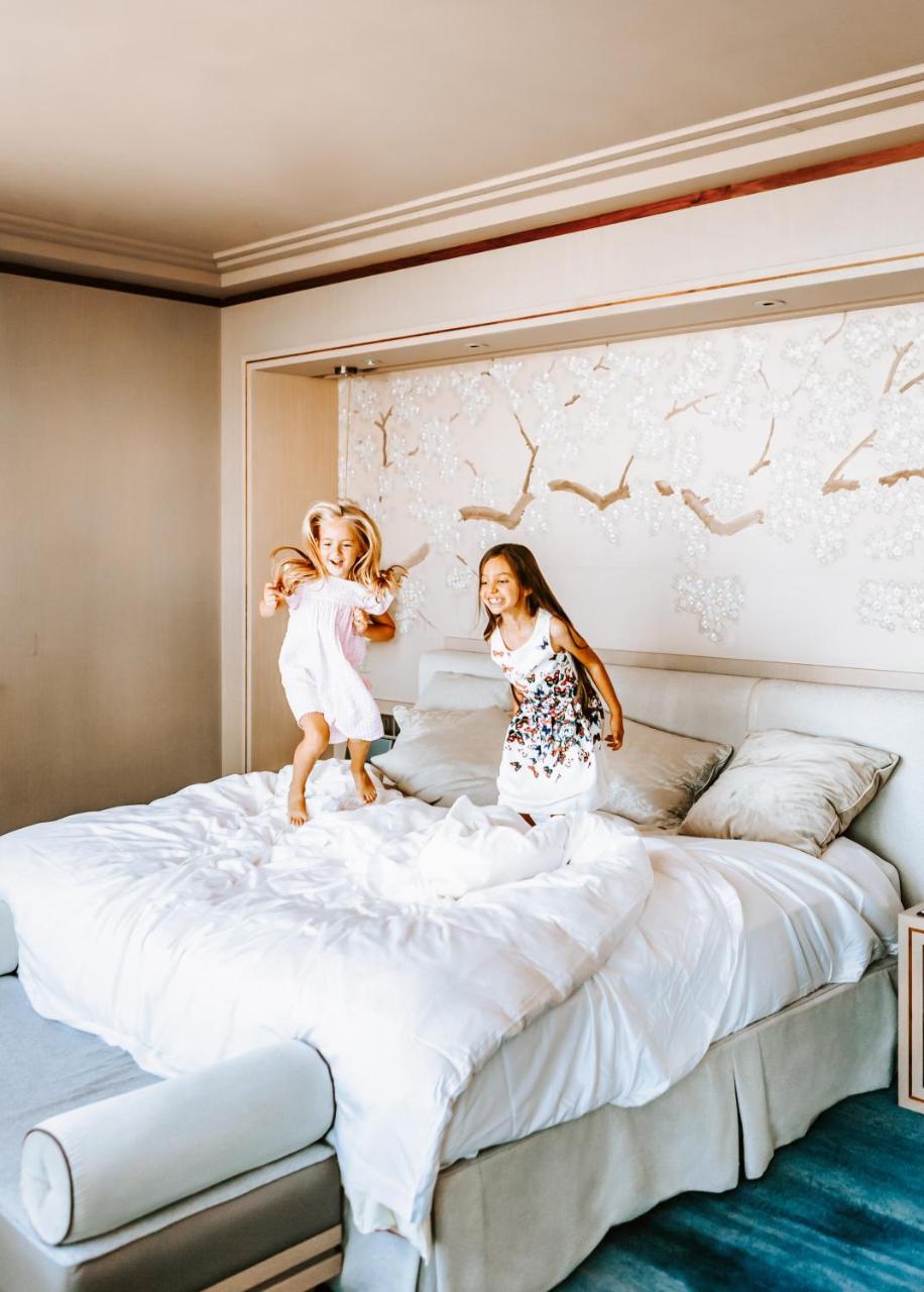 Shangri-La The Shard, London Exterior photo Two children jumping on a bed